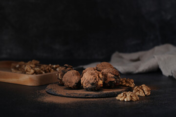 homemade sweets made from prunes, dates and nuts. The candies are round. candies for healthy eating