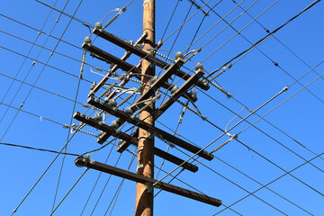 A utility pole with distribution of power lines