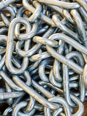 Galvanized steel chain close-up, industrial metal background