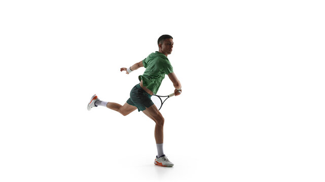 Tennis player turning after forehand follow through isolated on white background. Concept of stroke completion training, body rotation drills, tennis mechanics analysis, sports education visuals.