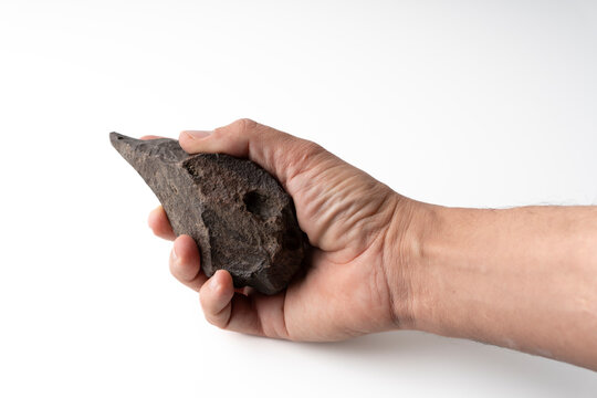 Stone Age Biface Artifact from Algeria. Prehistoric Flint Hand Tool. white background