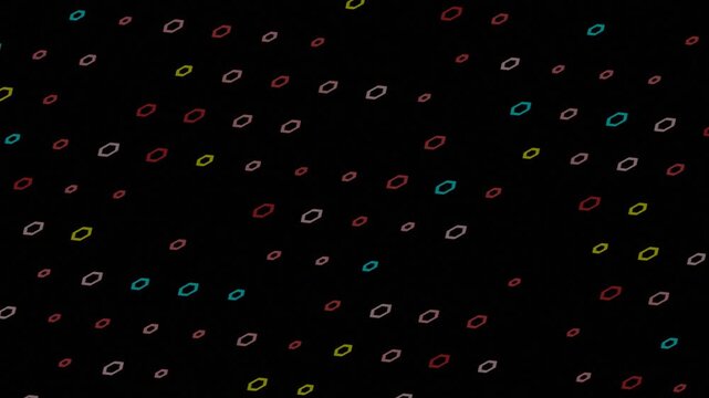 A dark abstract background featuring a multitude of small, colorful, oval-shaped rings scattered across the frame, creating a dynamic digital pattern.