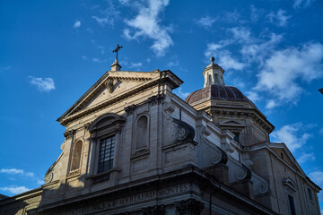 Obraz premium Historic church facade and dome against clear blue sky in Rome Italy