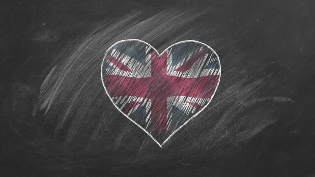National flag of United Kingdom in heart shape  drawn with colored chalk on a blackboard. English language, Learning English.