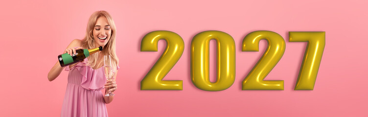 Obraz premium A person pours a drink while celebrating the new year 2027. The background is pink with large gold numbers showing the year. The mood is joyful and festive.