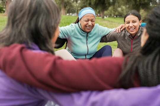 Women's circle during a group yoga class with people of different age and body types - Healthy lifestyle and meditation concept - Main focus on african female face