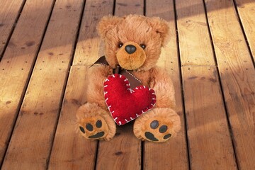 Fototapeta premium Teddy Bear hold red heart, love concept