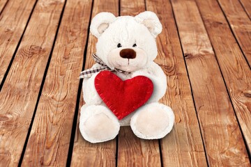 Fototapeta premium Teddy Bear hold red heart, love concept