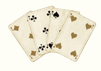 A hand of vintage playing cards showing four of the same value isolated on a white background.