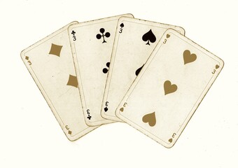 A hand of vintage playing cards showing four of the same value isolated on a white background.