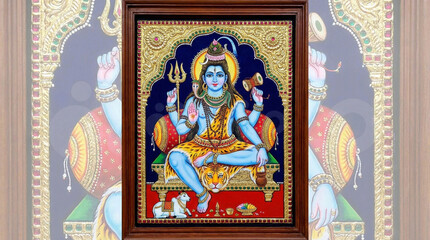 Fototapeta premium Traditional Tanjore Painting of Lord Shiva with Parvati and Nandi in Ornate Frame
