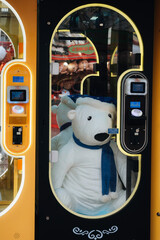 Plush toy vending machine with teddy bear inside © Kamil