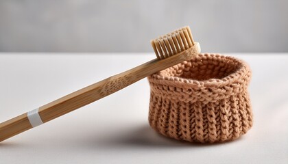 Naklejka premium Minimalist Bamboo Toothbrush With Knitted Holder High Resolution Picture