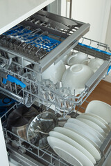 Open dishwasher with clean dishes