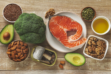 Various fresh healthy products on wooden table