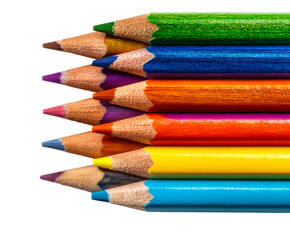 Stack of sharpened colored pencils arranged in a vibrant row with detailed tips pointing left in a creative and colorful artistic composition