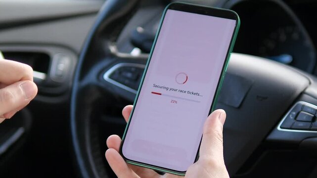 A racing enthusiast securing their spot for an upcoming motorsport event while on the go. The video follows the journey from reviewing ticket details to the successful confirmation of an electronic