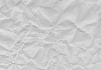 High-resolution white crumpled paper texture with soft folds and natural creases. Neutral background ideal for overlays, mockups, posters, packaging, editorial design, and minimalist compositions.