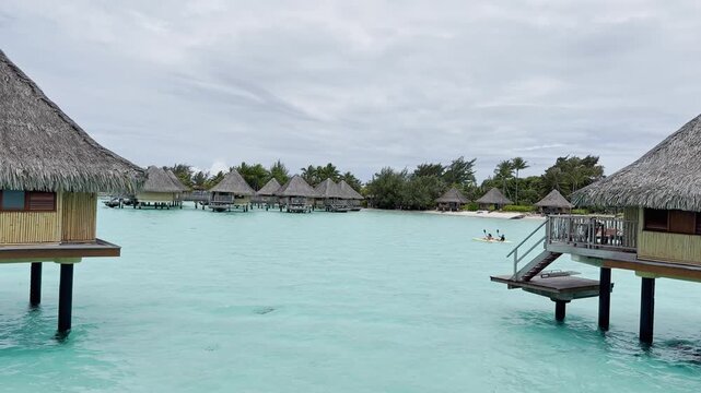 Summer Bora Bora Vacation Resort in French Polynesia with turquoise and aquamarine shallow lagoon clear water