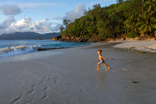 Mah&eacute; Island Seychelles Boy Toddler Playing at Beach Sunset Anse Soleil