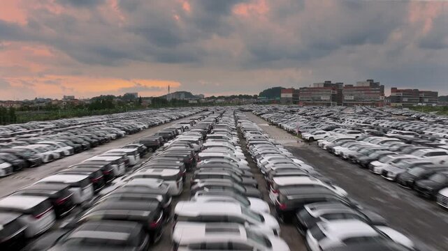 Big huge parking lot with many new cars, factory auto, dealerships salon outdoor, automotive sales industry. Transport terminal. Top aerial drone view. Long rows decommissioned vehicles, scrap metal.