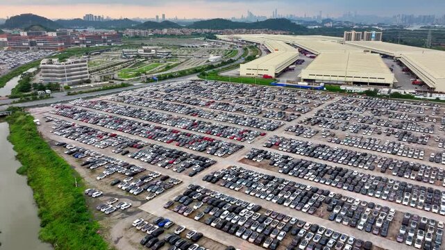 Big huge parking lot with many new cars, factory auto, dealerships salon outdoor, automotive sales industry. Transport terminal. Top aerial drone view. Long rows decommissioned vehicles, scrap metal.