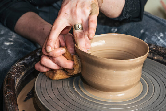 Close-up of potter working on workpiece