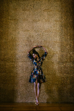 Portrait of chic woman wearing patterned dress
