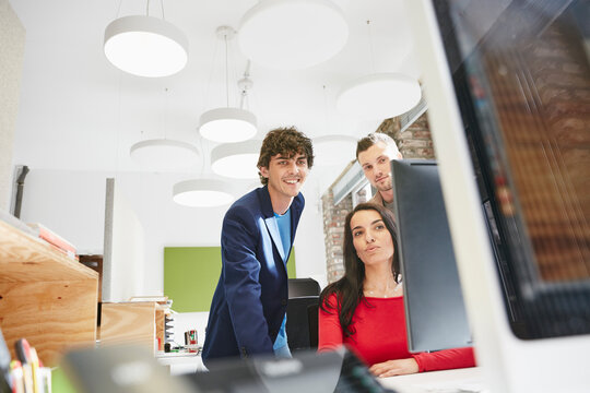 Creative team working together , using computer