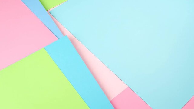 A pastel-colored abstract composition of folded paper in pink, green, and blue hues