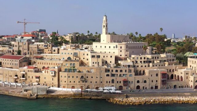 Beautiful view of Old Jaffa beach  Israel. Unique architecture with high skyscraper in background., 