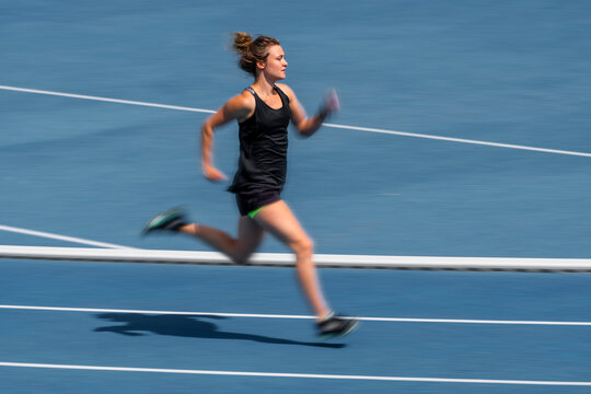 Female runner on tartan track