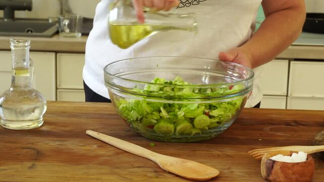 Woman cutting iceberg lettuce for salad
