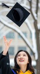 Throwing graduation caps into the sky at the winter graduation ceremony