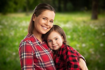 Obraz premium Mother and daughter have fun in park. Mother Day.