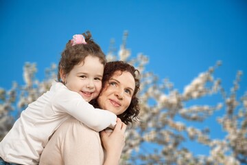 Obraz premium Mother and daughter have fun in park. Mother Day.