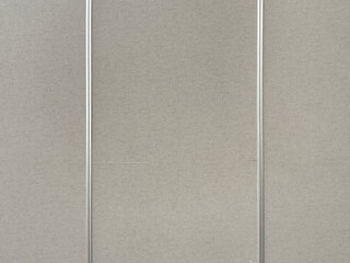 Fototapeta premium Close up of grey linen wallpaper with stainless aluminium frame and strips. Suitable for wall panel design. Seamless background texture.