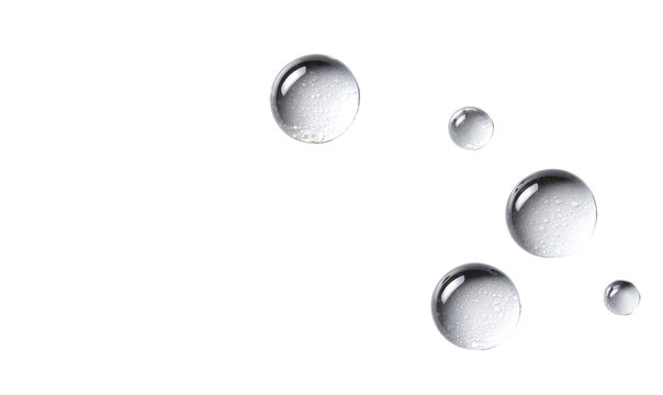 Cluster of translucent water droplets on a black background
