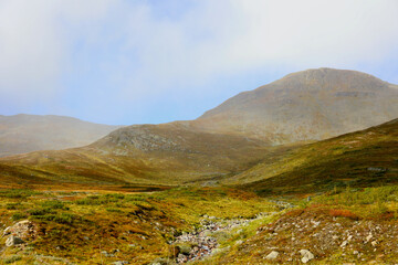 Rocky Stream and Misty Hills in Aurlandsfjellet, Norway &ndash; Nordic Highland Wilderness