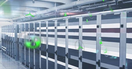 Extending centered row of server cabinets running down data center aisle, showing green holograms