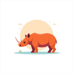 A rhinoceros standing on grass in front of a large orange circle