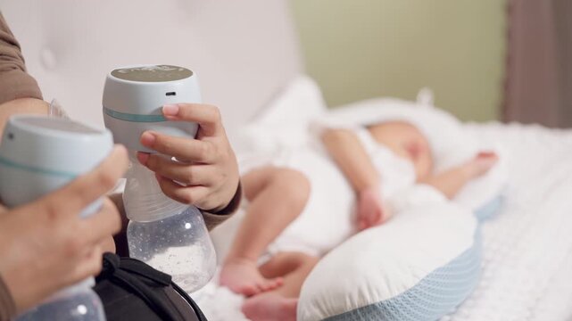 Mother uses electric breast pump while newborn baby sleeps. Focus on breastfeeding, care, and healthy parenting routine.
