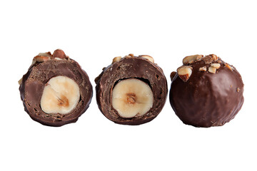 Three halved chocolate truffles, filled with hazelnut halves, coated in dark chocolate, and topped with chopped nuts