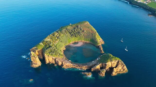 Island of Vila Franca do Campo in San Miguel, Azores, Portugal. Aerial view of the small island with round crater lagoon bay in Atlantic ocean