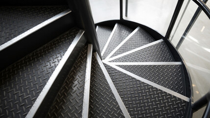 Modern spiral staircase with metal grating steps