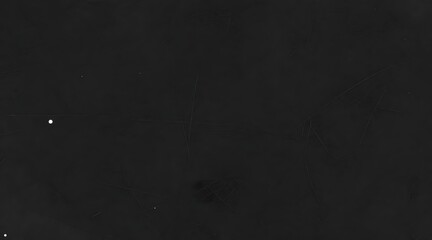 Fototapeta premium Grungy black surface with scratches and imperfections creating an abstract background