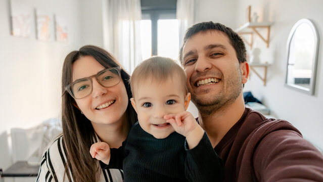 Family enjoying time with their 7-month-old baby