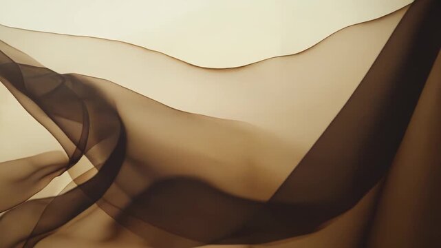 Fluid translucent fabric creating elegant abstract waves and soft textures against a warm background, suggesting gentle movement, freedom, and softness