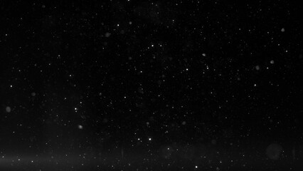 Obraz premium Mysterious night sky with stars and snowflakes against a dark background