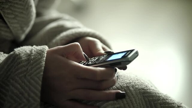Female Typing on a Vintage Push-Button Mobile Phone. Using a  Cellphone for Texting  